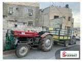 تراكتور مع ترلة مع عود حراث