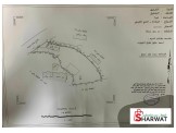 أرض مع محلات عظم على الشارع في منطقة الصليب/ دورا  Image 1